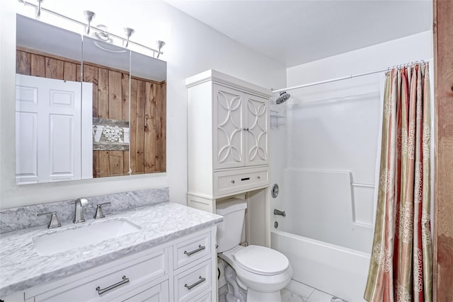 full bathroom featuring vanity, marble finish floor, shower / tub combo, and toilet