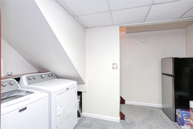 laundry room featuring baseboards, light carpet, laundry area, and washer and clothes dryer