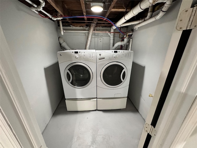 washroom with washing machine and dryer