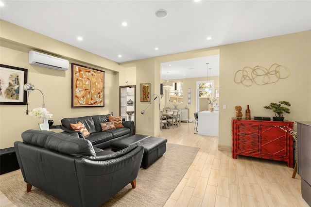 living area featuring recessed lighting, an AC wall unit, and light wood-style flooring