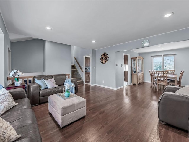 living area featuring recessed lighting, stairway, baseboards, and dark wood-style flooring