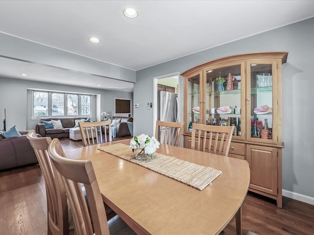 dining room featuring recessed lighting, baseboards, and dark wood-style flooring