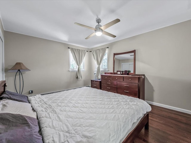 bedroom with ceiling fan, dark wood-type flooring, baseboards, and a baseboard radiator