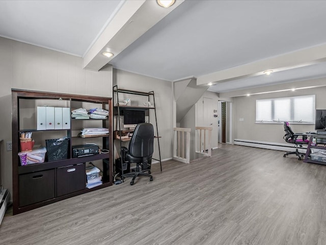 home office featuring wood finished floors, baseboard heating, and ornamental molding