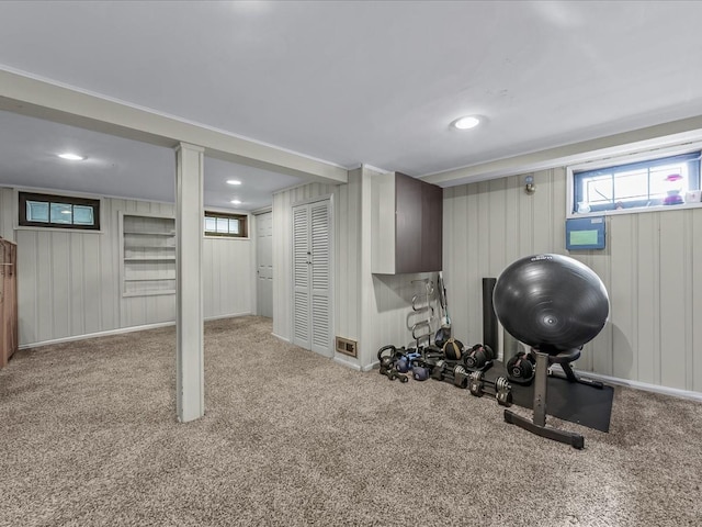 exercise room featuring recessed lighting and carpet floors