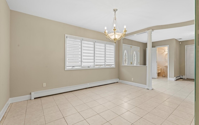 unfurnished room with ornate columns, baseboards, light tile patterned floors, and a baseboard heating unit