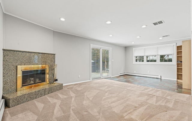 unfurnished living room with carpet flooring, a fireplace, visible vents, and baseboard heating