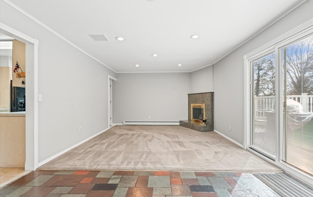 unfurnished living room with crown molding, a baseboard radiator, carpet flooring, and a fireplace