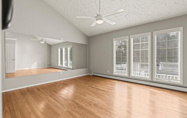 unfurnished room with a healthy amount of sunlight, hardwood / wood-style floors, a baseboard radiator, and a ceiling fan