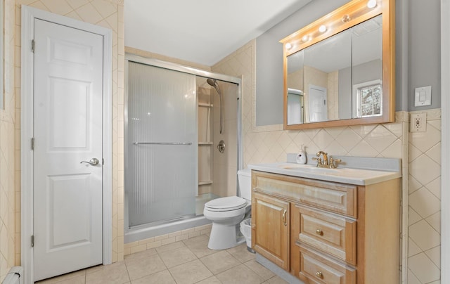 bathroom with toilet, a baseboard radiator, tile patterned flooring, a shower stall, and tile walls