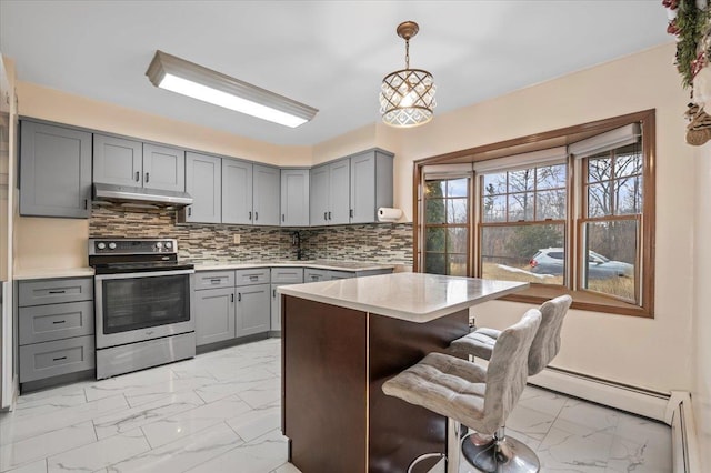 kitchen featuring under cabinet range hood, marble finish floor, gray cabinetry, and stainless steel electric range oven