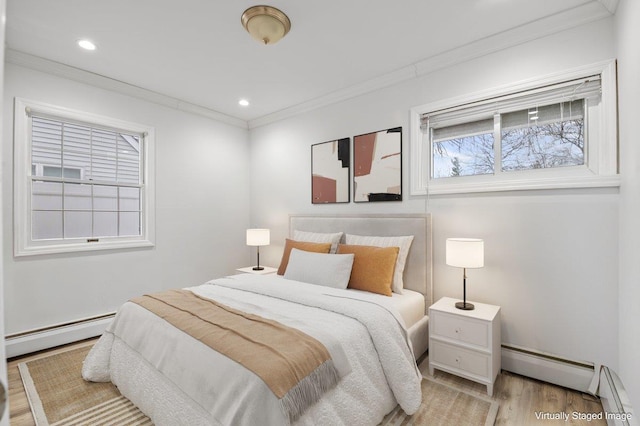 bedroom featuring recessed lighting, light wood-type flooring, baseboard heating, and crown molding