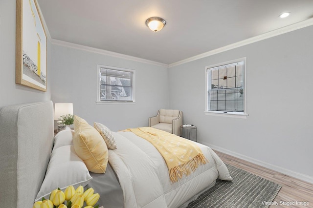 bedroom featuring baseboards, multiple windows, and crown molding