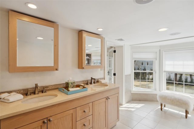 full bathroom featuring tile patterned floors, recessed lighting, visible vents, and a sink