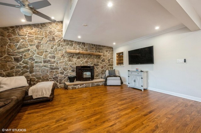 unfurnished living room with ceiling fan, recessed lighting, baseboards, wood finished floors, and ornamental molding
