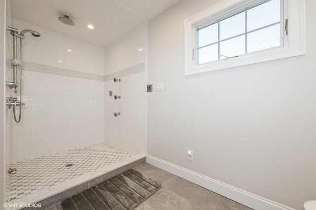 full bath with baseboards, recessed lighting, and a shower stall