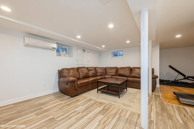living area featuring light wood-style floors, recessed lighting, baseboards, and a wall mounted AC