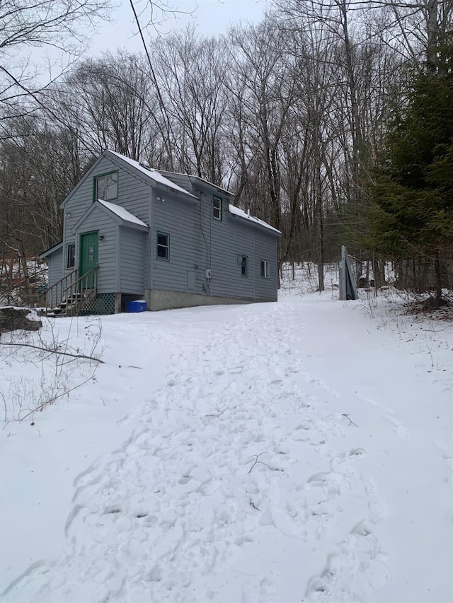 view of snow covered house