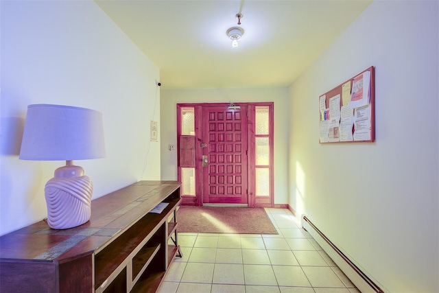 entryway with tile patterned floors and baseboard heating