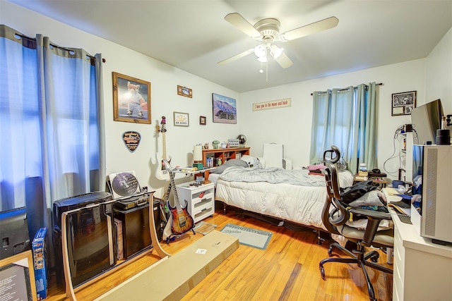 bedroom featuring wood-type flooring and ceiling fan