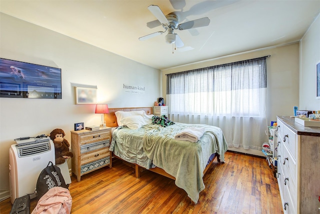 bedroom featuring a ceiling fan and hardwood / wood-style floors