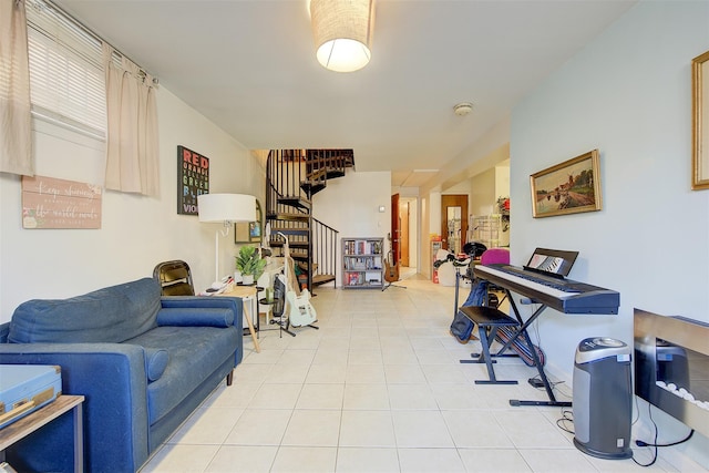 living room with light tile patterned floors and stairs