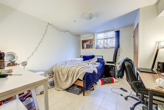 bedroom with light tile patterned floors