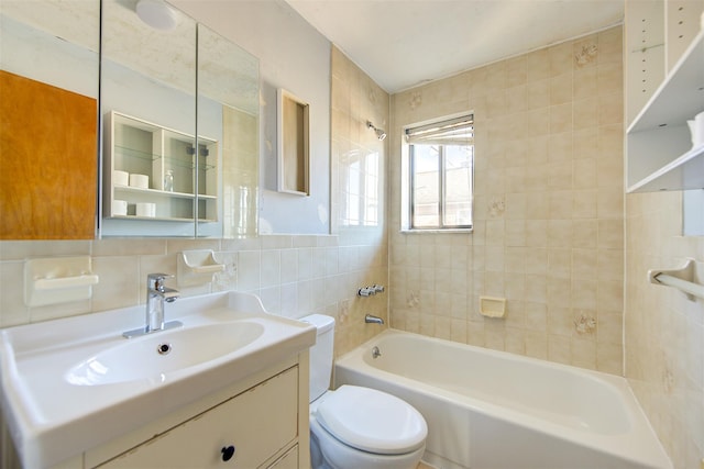 bathroom with tile walls, toilet, shower / tub combination, decorative backsplash, and vanity