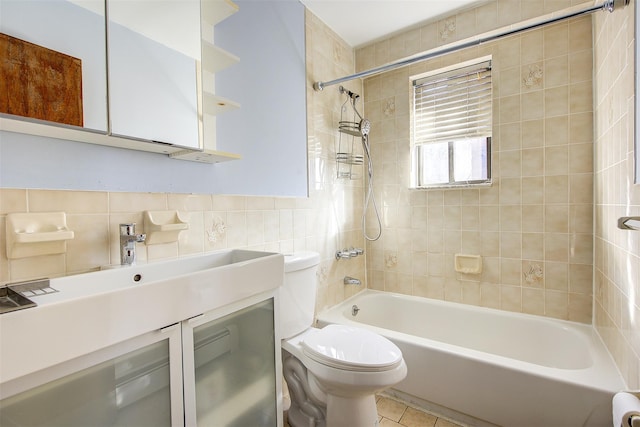 bathroom featuring shower / bath combination, toilet, tile walls, and vanity