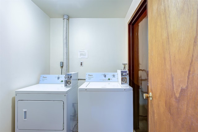 washroom featuring laundry area and washer and dryer