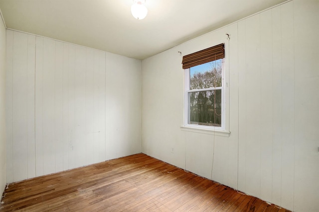 spare room with hardwood / wood-style flooring