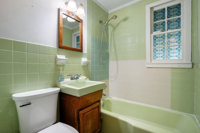 bathroom featuring bathtub / shower combination, tile walls, toilet, and vanity