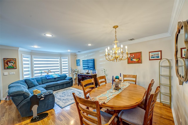 dining space with recessed lighting, wood finished floors, visible vents, and ornamental molding