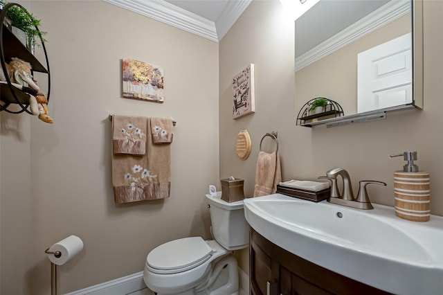 half bath featuring baseboards, toilet, vanity, and crown molding