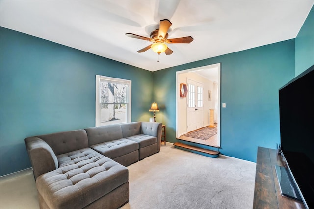 living area with ceiling fan