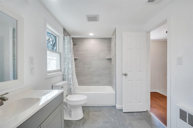 full bathroom featuring visible vents, shower / bath combo with shower curtain, toilet, and vanity