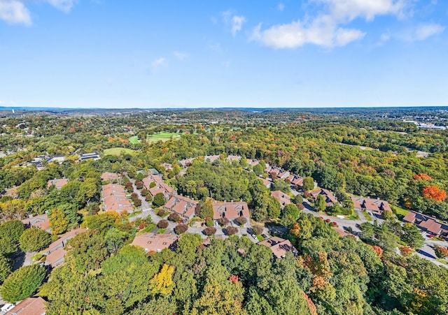 drone / aerial view with a residential view and a view of trees