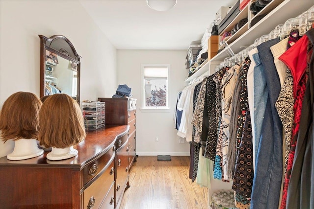 spacious closet featuring light wood-style flooring