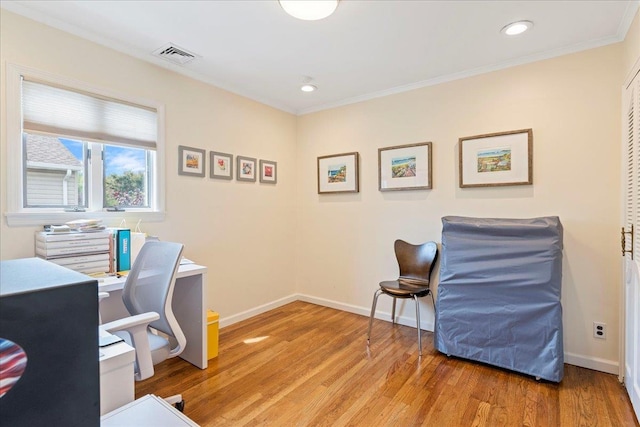 office area featuring baseboards, visible vents, recessed lighting, crown molding, and light wood-type flooring