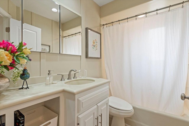 bathroom featuring vanity, toilet, and shower / bathtub combination with curtain