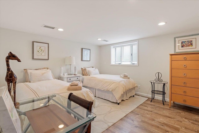 bedroom with recessed lighting, visible vents, light wood finished floors, and baseboards