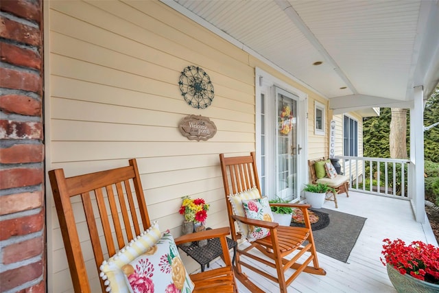 wooden terrace with a porch