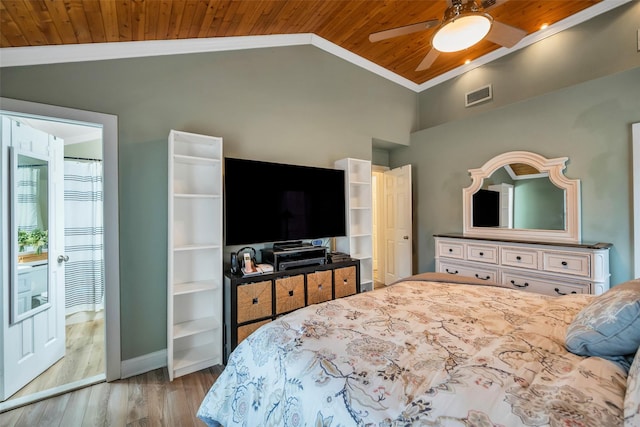 bedroom with visible vents, lofted ceiling, wooden ceiling, and crown molding