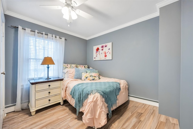 bedroom with crown molding, light wood finished floors, and baseboard heating