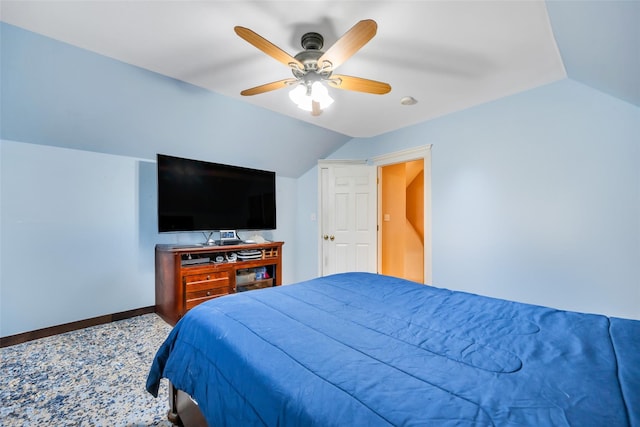 bedroom with a ceiling fan, baseboards, and vaulted ceiling