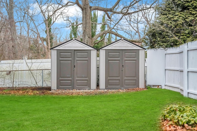 view of shed with a fenced backyard