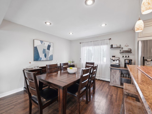 dining space with recessed lighting, baseboards, and dark wood-style flooring