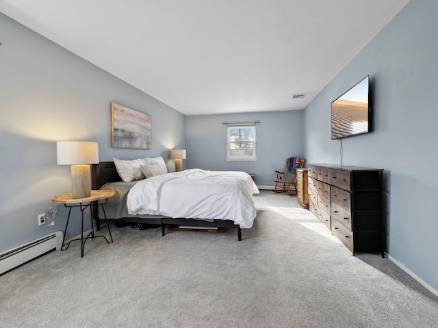 bedroom featuring carpet flooring, visible vents, a baseboard heating unit, and baseboards