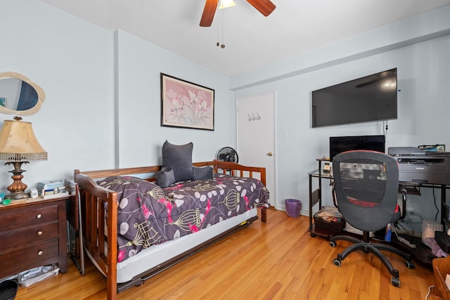 bedroom with wood finished floors and a ceiling fan