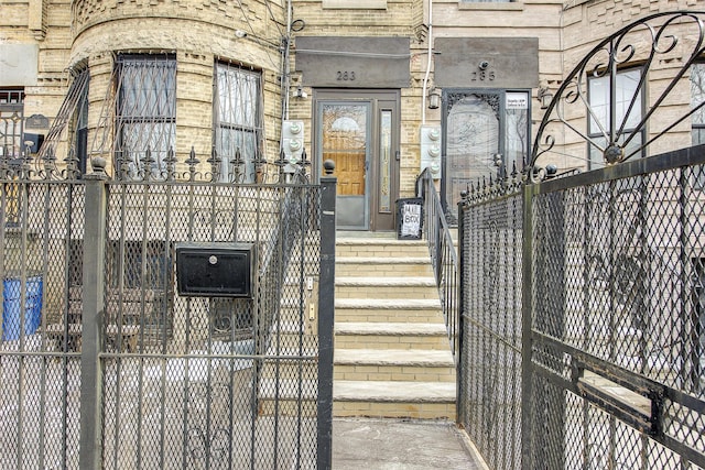 doorway to property with fence